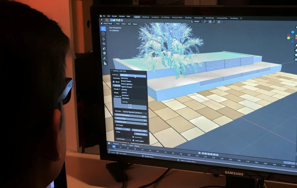 Concepteur travaillant sur une scène 3D dans un logiciel de modélisation à l'écran